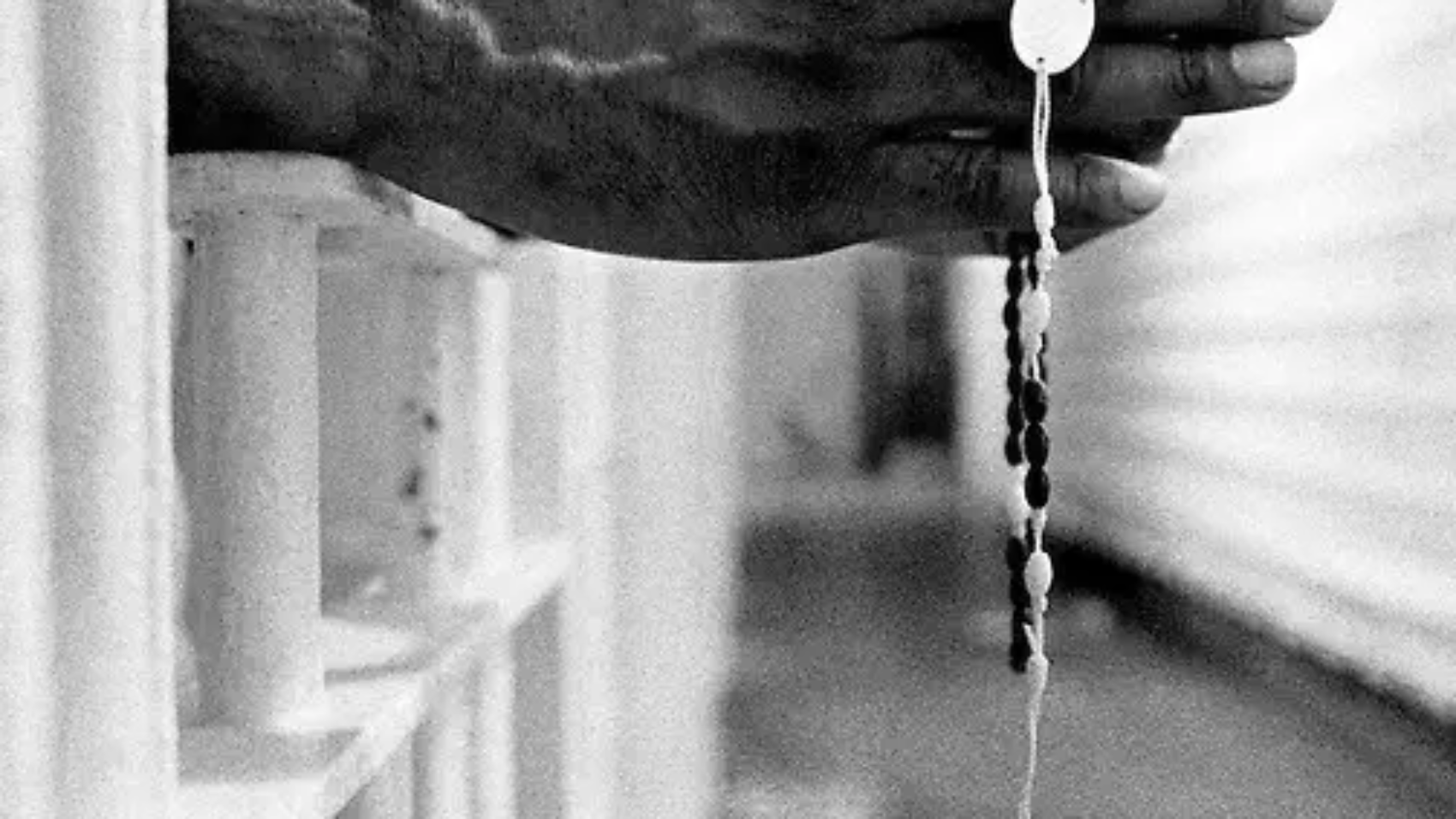 An inmate with a jail issued cross inside the segregation unit at Pitchess Honor Rancho, one of the ten different units that comprise the sprawling Los Angeles County Jail system which houses 21,000 inmates, the world's largest jail population.