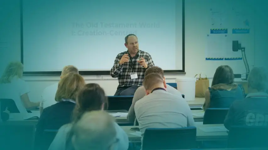 Image of Freddy Hedley taching classroom - Bursaries page