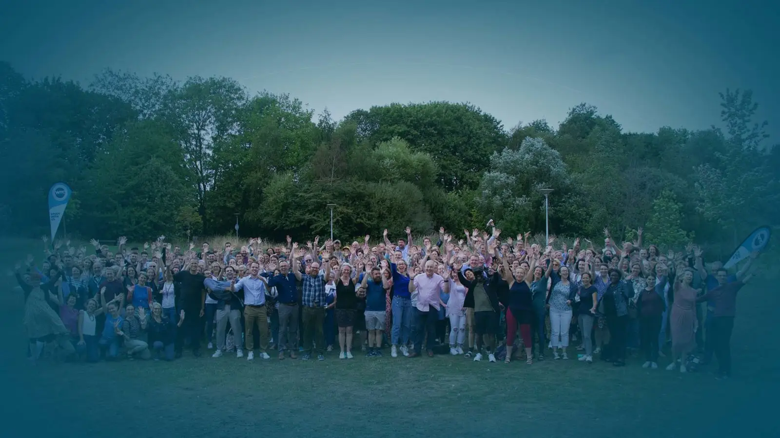 Image of all WTC people waving - about us page