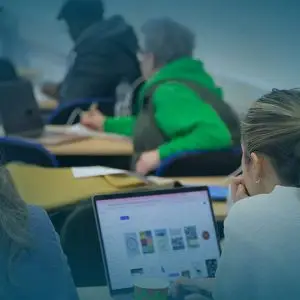 WTC students in classroom listening - give page