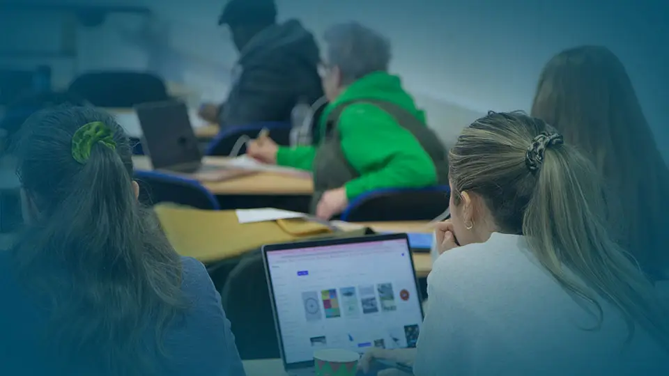 WTC students in classroom listening - give page