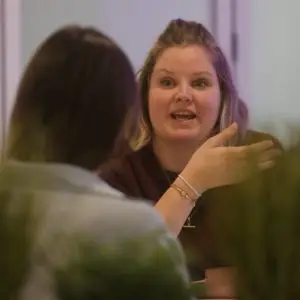 2 female students chatting in Manchester Hub