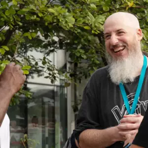 Two men laughing at WTC Residential